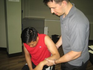 Helping a victim get up with Emergency First Aid Certification