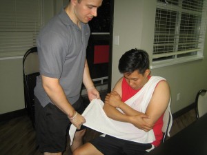 Immobilizing an injured arm using a sling.